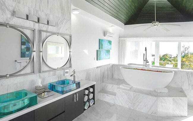 Polished Calacatta natural stone shower tile from Stoneline Group, showcasing elegant veining and a luxurious bathroom finish