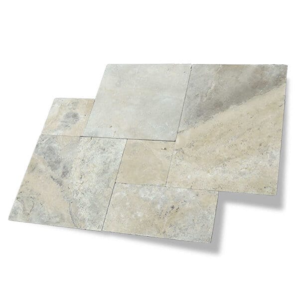 A set of beige and gray Kashmir Paver stone tiles arranged in a staggered, puzzle-like pattern, featuring different shapes and subtle color variations.