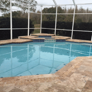 Luxury travertine paving around modern outdoor living space