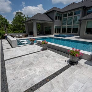 Tundra Grey marble paver pool deck design with natural stone texture and modern outdoor living space