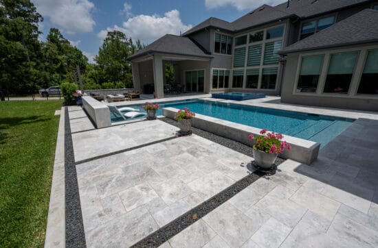 Tundra Grey marble paver pool deck design with natural stone texture and modern outdoor living space