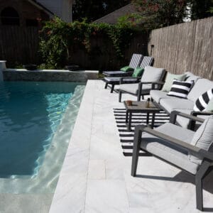 Bianco Sivec marble pool deck with minimalist landscape design