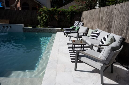 Bianco Sivec marble pool deck with minimalist landscape design