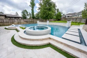 Luxury natural stone pool coping design around modern swimming pool