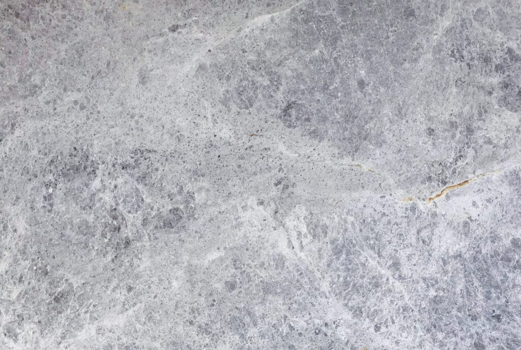 Tundra Grey marble tile with rich grey tones and natural veining